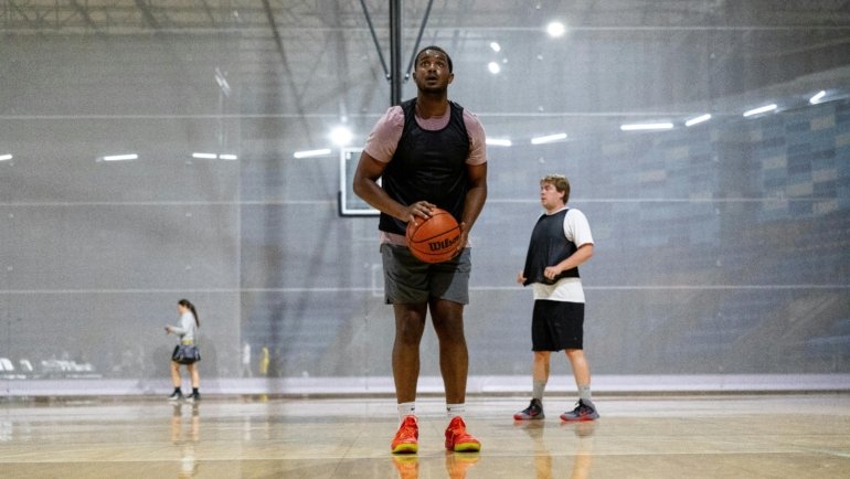 Competitive youth travel basketball team practice with young players developing skills and teamwork, preparing for AAU club tryouts and tournaments.