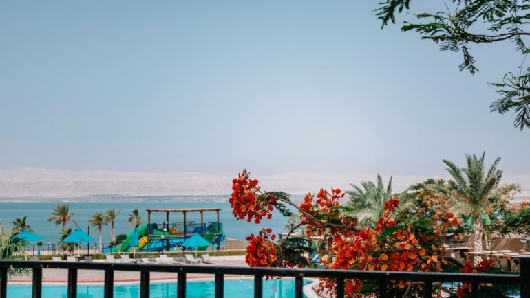 A vibrant illustration or collage of diverse August travel destinations, including European cities, sunny beaches, and adventurous landscapes, inspiring the perfect summer holiday.