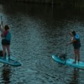 The WanderFit Sisters, Alex and Chloe, inspiring healthy travel, fitness, and wellness while exploring a scenic destination.