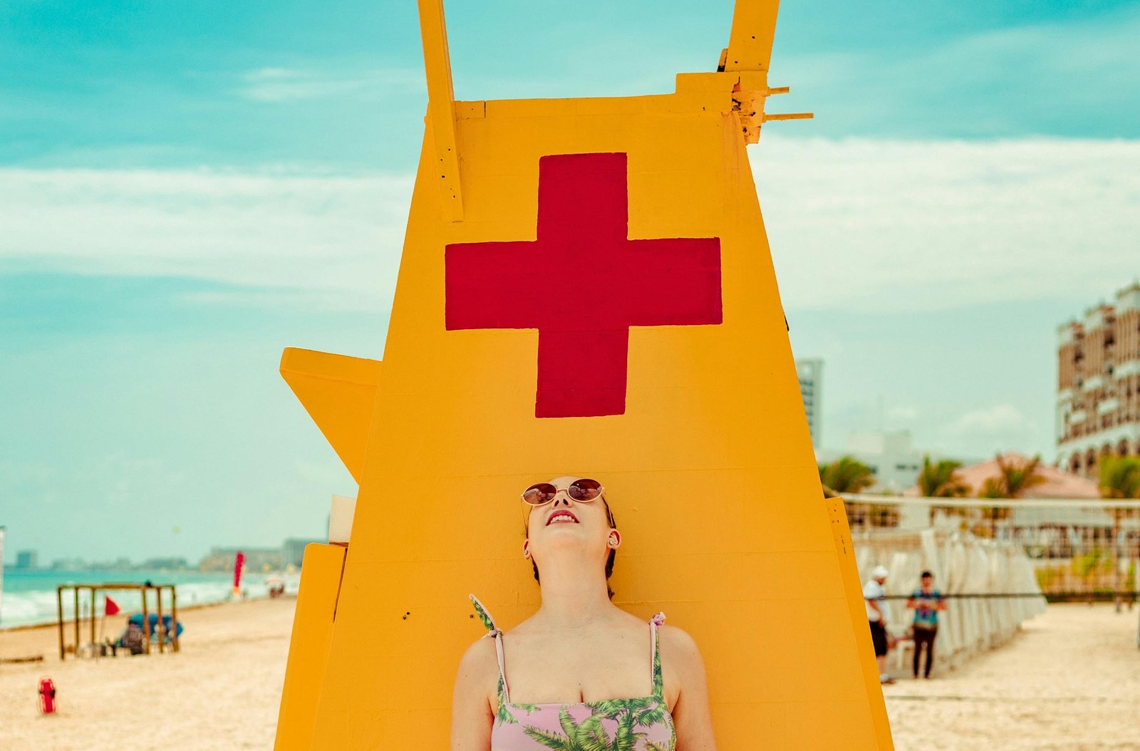Happy traveler relaxing on a beautiful beach in Mexico, symbolizing the peace of mind and protection provided by comprehensive travel insurance for a worry-free vacation.