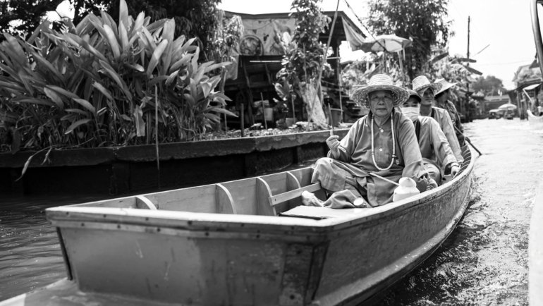 Authentic and adventurous travel: A traveler deeply engaged in a local cultural experience or exploring an off-the-beaten-path natural landscape, emphasizing genuine connection and personal growth.