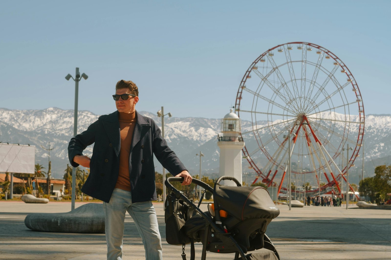 Modern family traveling with a Nuna double travel stroller, highlighting its sleek design, compact fold, and ease of use for two children in an airport or urban setting.