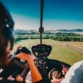 Confident LPN nurse with a city skyline in the background, representing exciting travel nursing jobs for licensed practical nursing and professional growth.