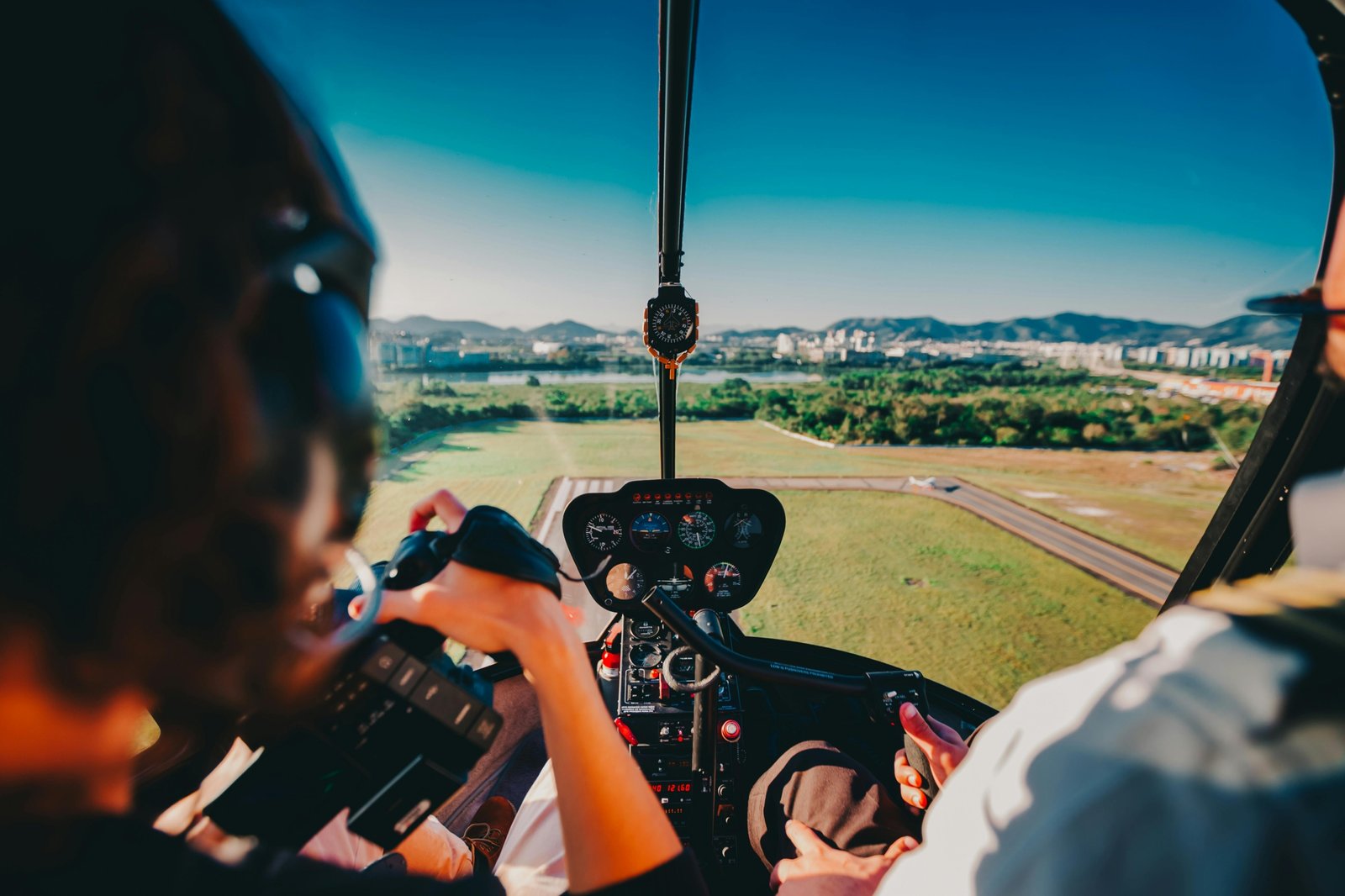 Confident LPN nurse with a city skyline in the background, representing exciting travel nursing jobs for licensed practical nursing and professional growth.