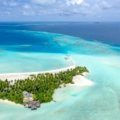 Stunning tropical beach with turquoise water and palm trees, symbolizing accessible passport-free travel for U.S. citizens to destinations like Puerto Rico, U.S. Virgin Islands, Guam, and American Samoa.