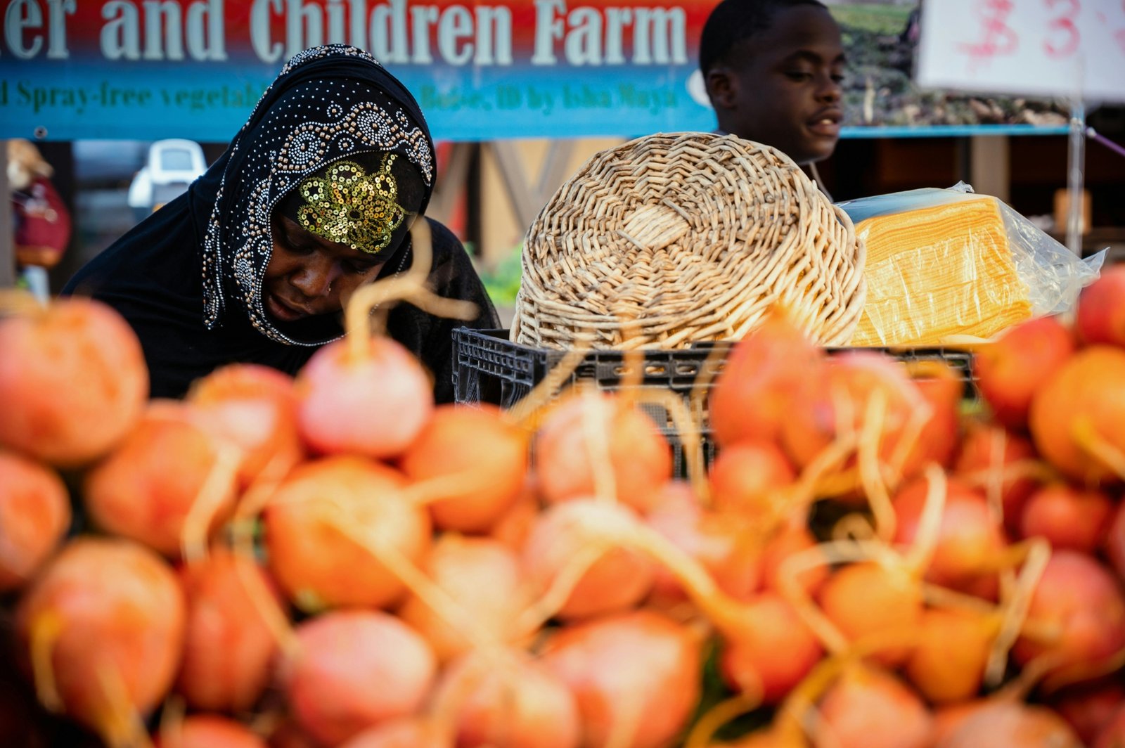 Vibrant outdoor scene at the Travelers Rest Farmers Market in South Carolina, showcasing local vendors and diverse shoppers amidst colorful stalls of fresh produce, artisanal crafts, baked goods, and community products.