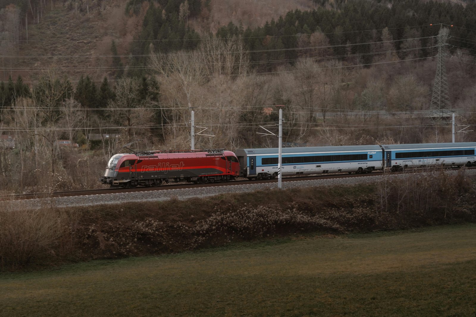 A modern high-speed train traveling through the beautiful European countryside, symbolizing the comfortable and scenic rail journey from Zurich to Paris.
