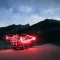 Mercedes Sprinter travel van conversion parked on a scenic road, illustrating the comfort and freedom of van life adventure.