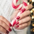 eos holiday vanilla cashmere travel hand cream providing deep hydration for soft hands during festive winter travels, featuring its compact size and luxurious scent.