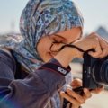 Joyful educator exploring a unique travel destination, representing the valuable WEA travel programs and discounts available for teachers' professional development and personal enrichment.