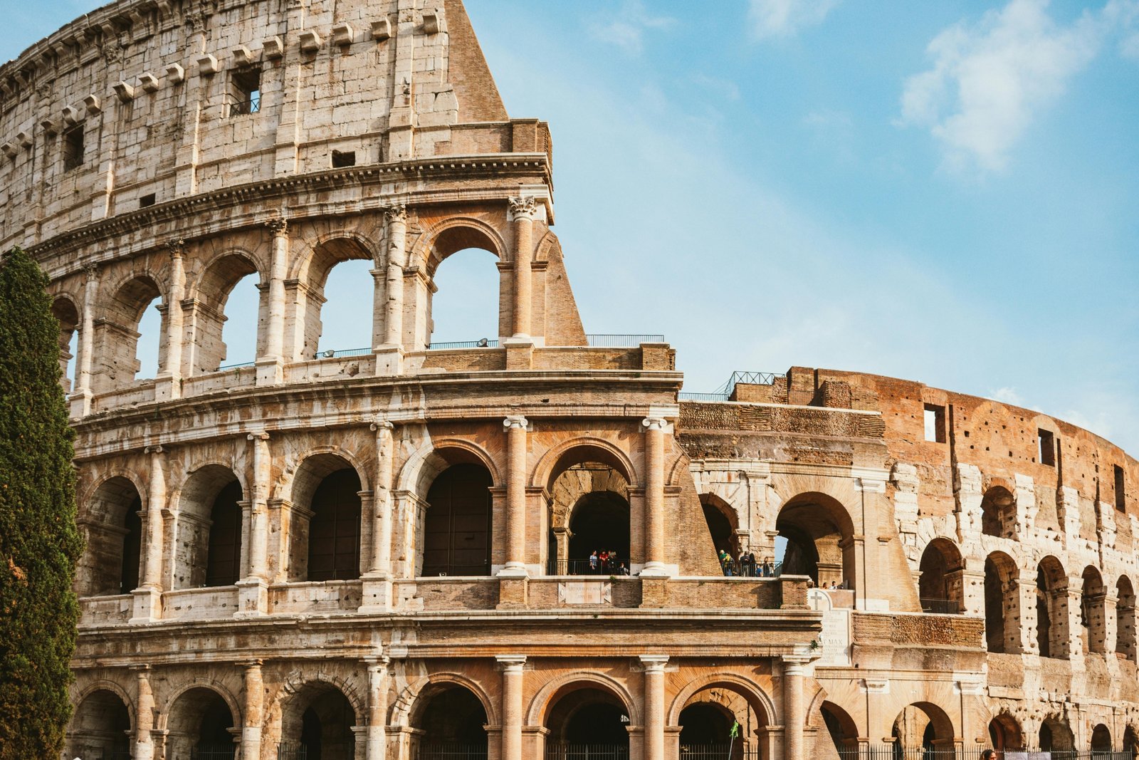 Happy travelers exploring an iconic Roman landmark, illustrating the joy and convenience of Rome travel packages for a dream Italian vacation.