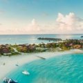 Breathtaking tropical all-inclusive resort with white sand beach and turquoise ocean, perfect for a luxurious, stress-free Costco Travel vacation and dream getaway.