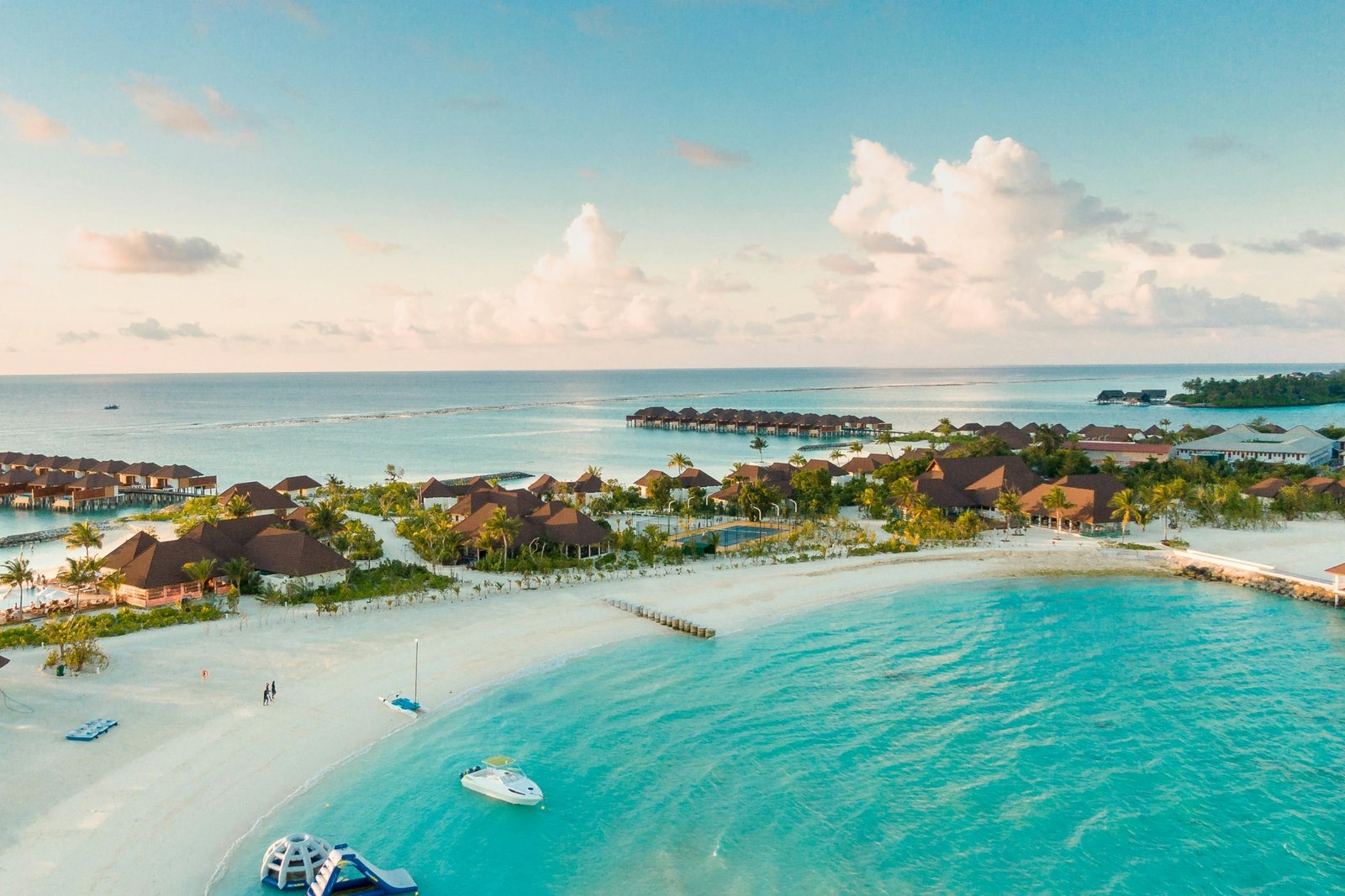 Breathtaking tropical all-inclusive resort with white sand beach and turquoise ocean, perfect for a luxurious, stress-free Costco Travel vacation and dream getaway.