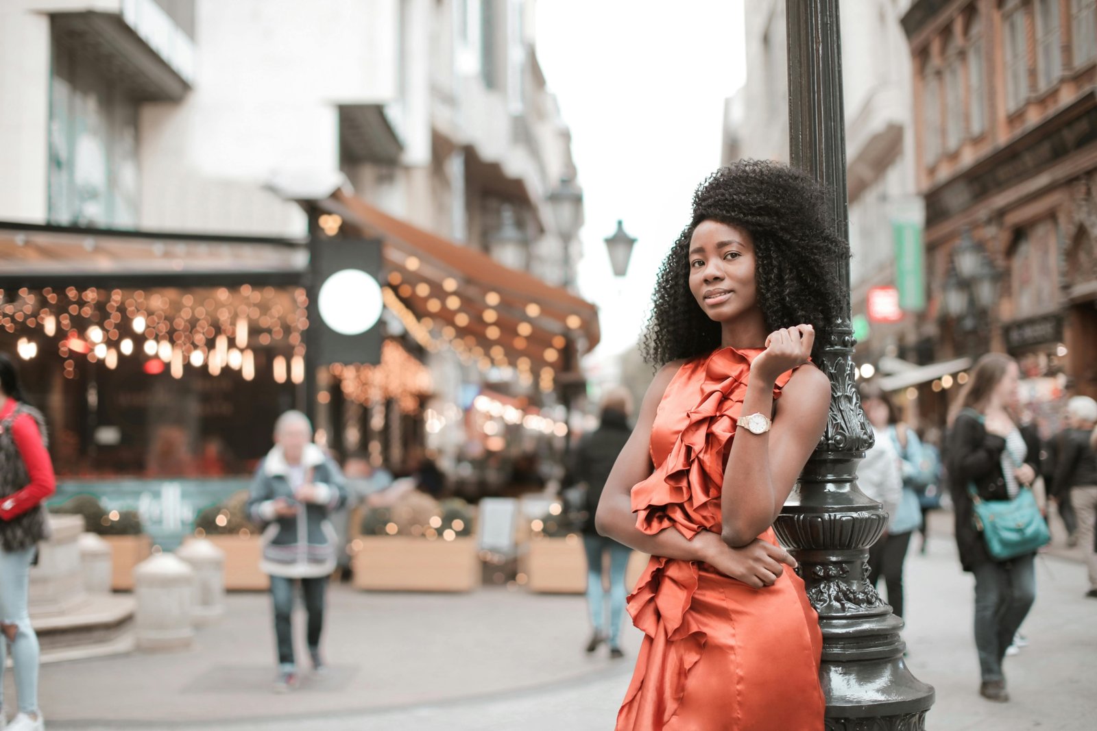 Stylish woman in a comfortable, wrinkle-resistant travel dress exploring a vibrant city street, embodying versatile female travel fashion and smart packing.