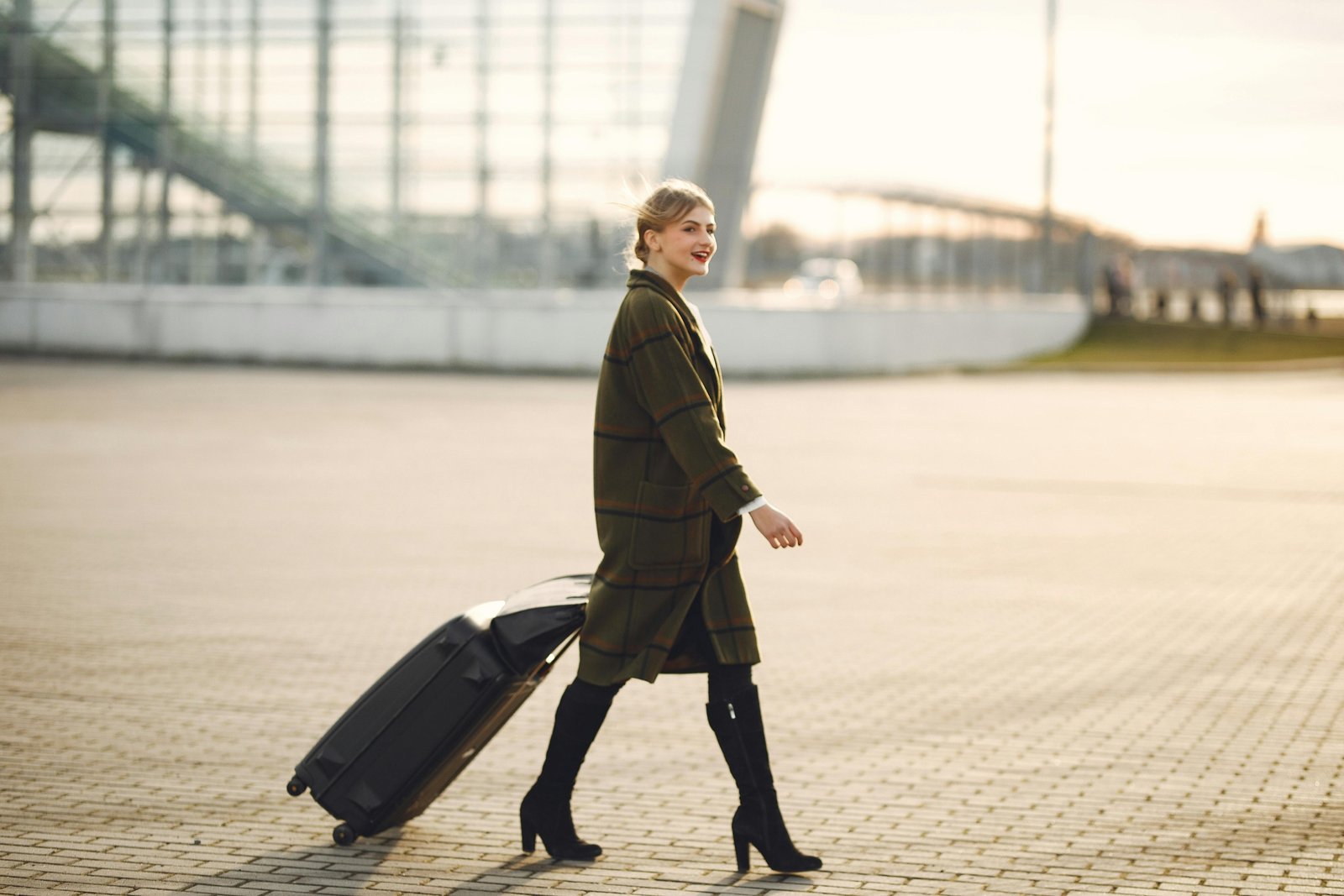 Longchamp travel suitcase at an airport, symbolizing luxury, durability, and timeless elegance for discerning travelers. Features premium design and smooth-rolling wheels.