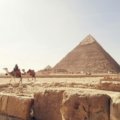 Diverse landscape representing a combined Africa and Middle East travel itinerary, featuring ancient historical sites, desert vistas, and vibrant wildlife, ideal for an epic adventure.