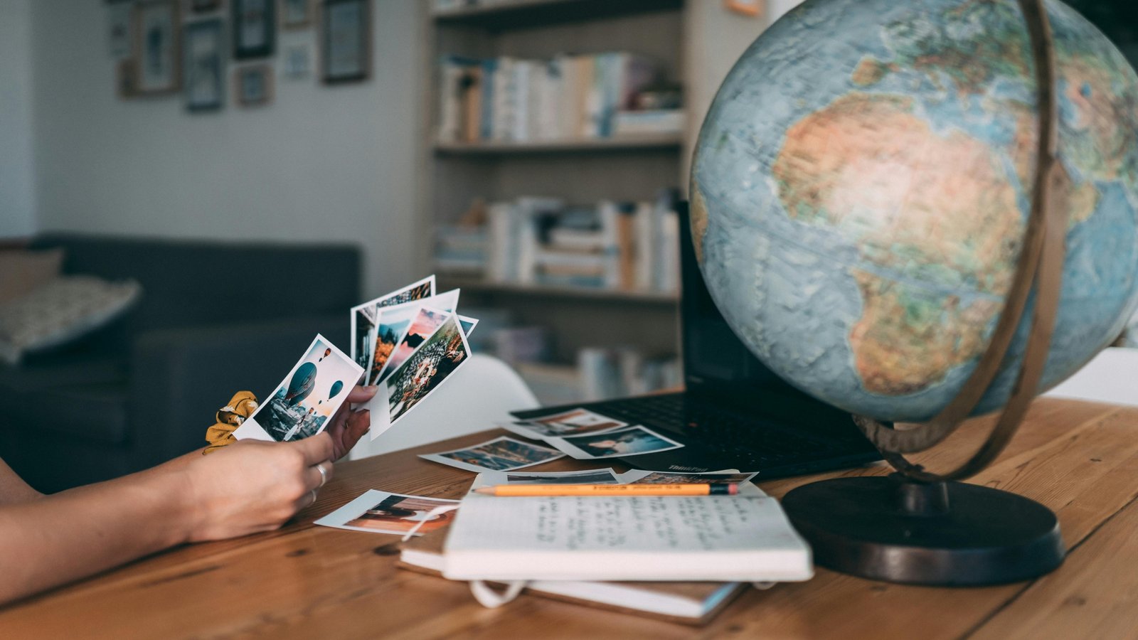 An inspiring image of someone planning their bucket list travel destinations on a world map, envisioning unforgettable global adventures and cultural experiences.