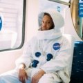 Traveler laughing at a relatable travel mishap, symbolizing the universal humor and shared experiences celebrated in travel memes.