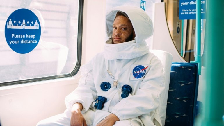 Traveler laughing at a relatable travel mishap, symbolizing the universal humor and shared experiences celebrated in travel memes.