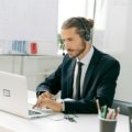 Professional travel agent using MSC Travel Agent Portal (MSC Book) on a laptop for efficient cruise bookings, sales, and management.