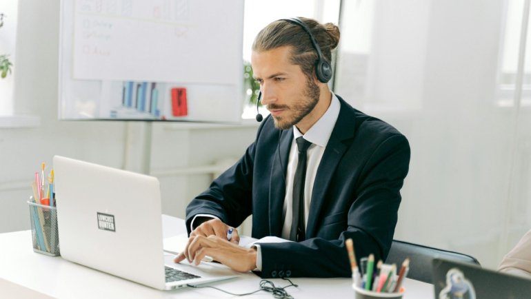 Professional travel agent using MSC Travel Agent Portal (MSC Book) on a laptop for efficient cruise bookings, sales, and management.