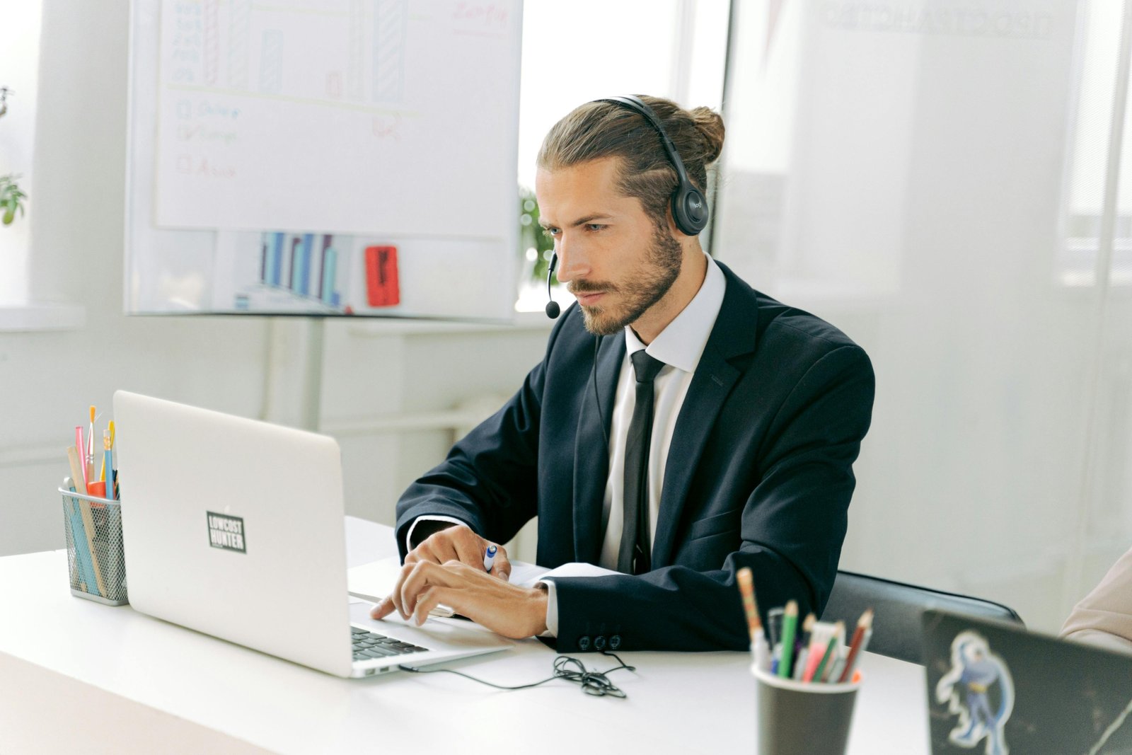 Professional travel agent using MSC Travel Agent Portal (MSC Book) on a laptop for efficient cruise bookings, sales, and management.