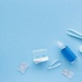 Clear Care travel size contact lens solution bottle in a clear TSA-approved carry-on bag, demonstrating effortless packing for contact lens wearers.