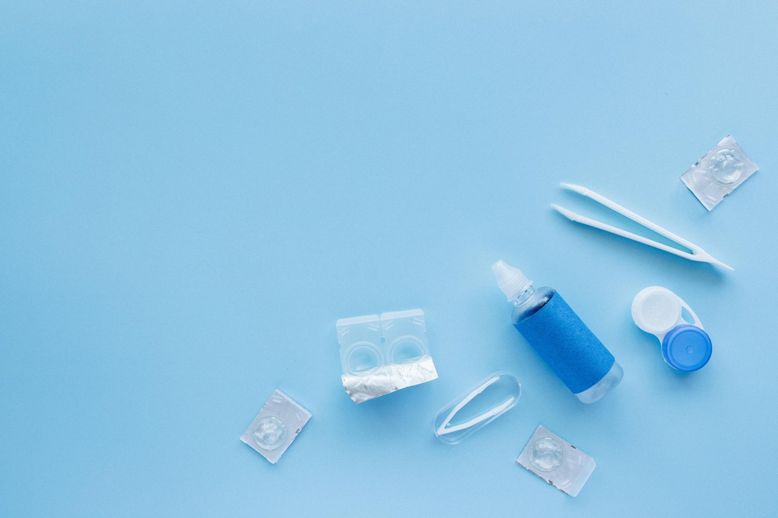 Clear Care travel size contact lens solution bottle in a clear TSA-approved carry-on bag, demonstrating effortless packing for contact lens wearers.