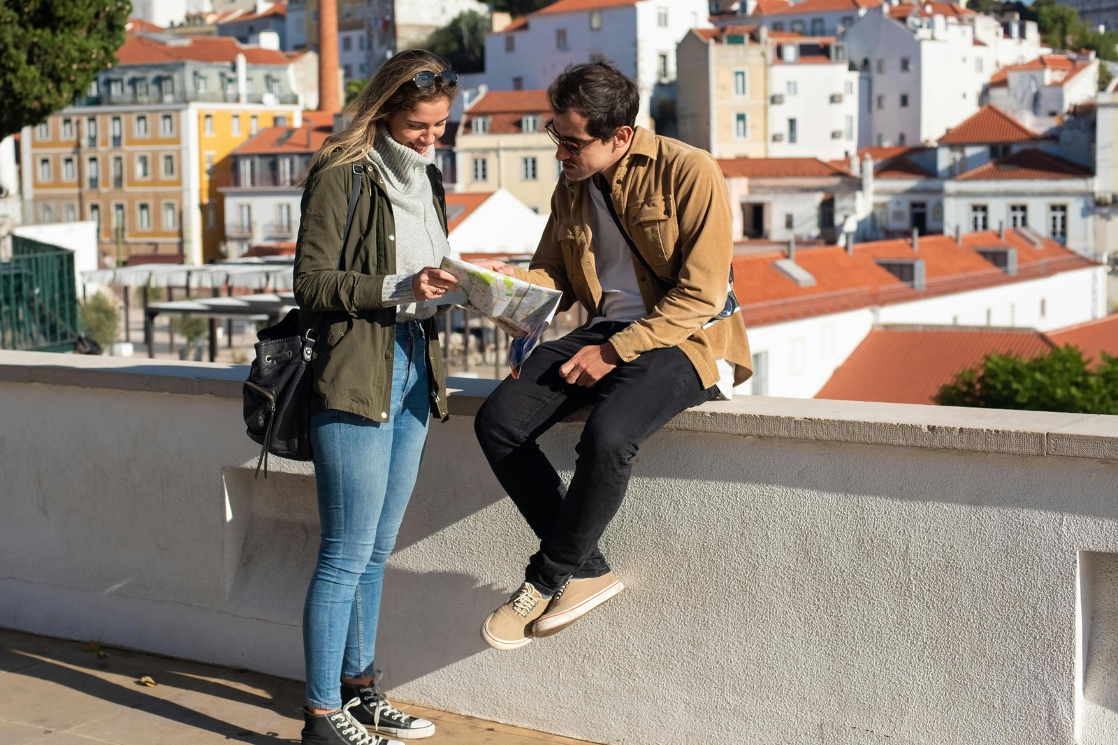 Happy person consulting a map or smartphone to discover local hidden gems, planning a day trip or weekend getaway for an accessible travel adventure near home.