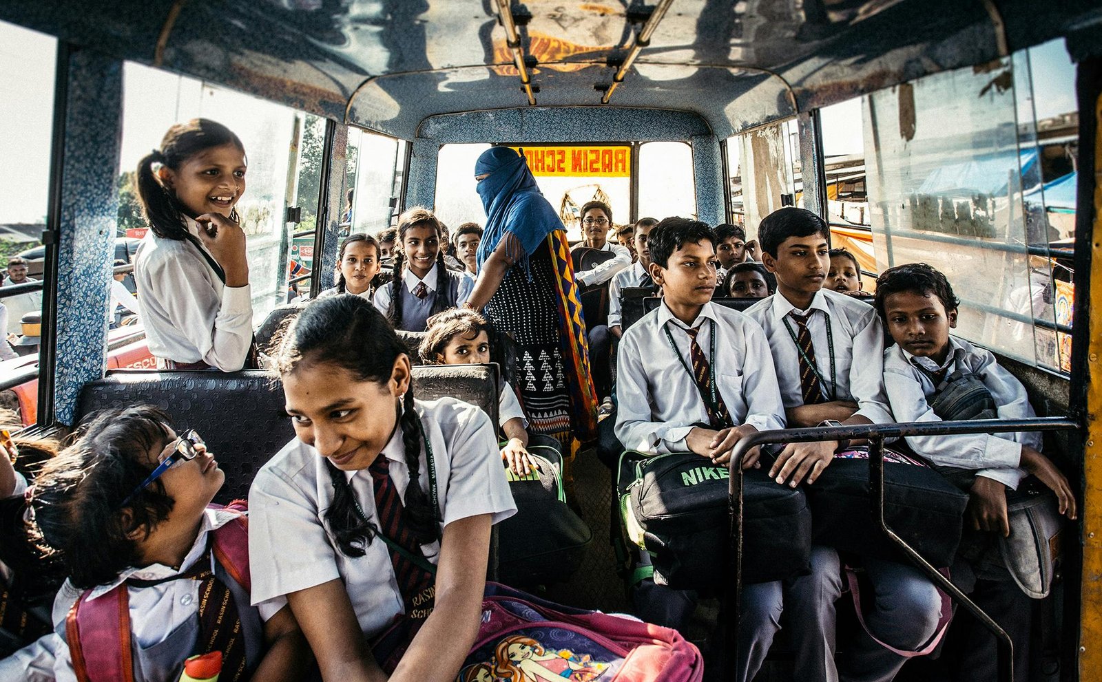 A diverse group of smiling middle and high school students participating in a cultural activity or adventure abroad, representing Putney Student Travel's immersive summer programs for global awareness and personal growth.