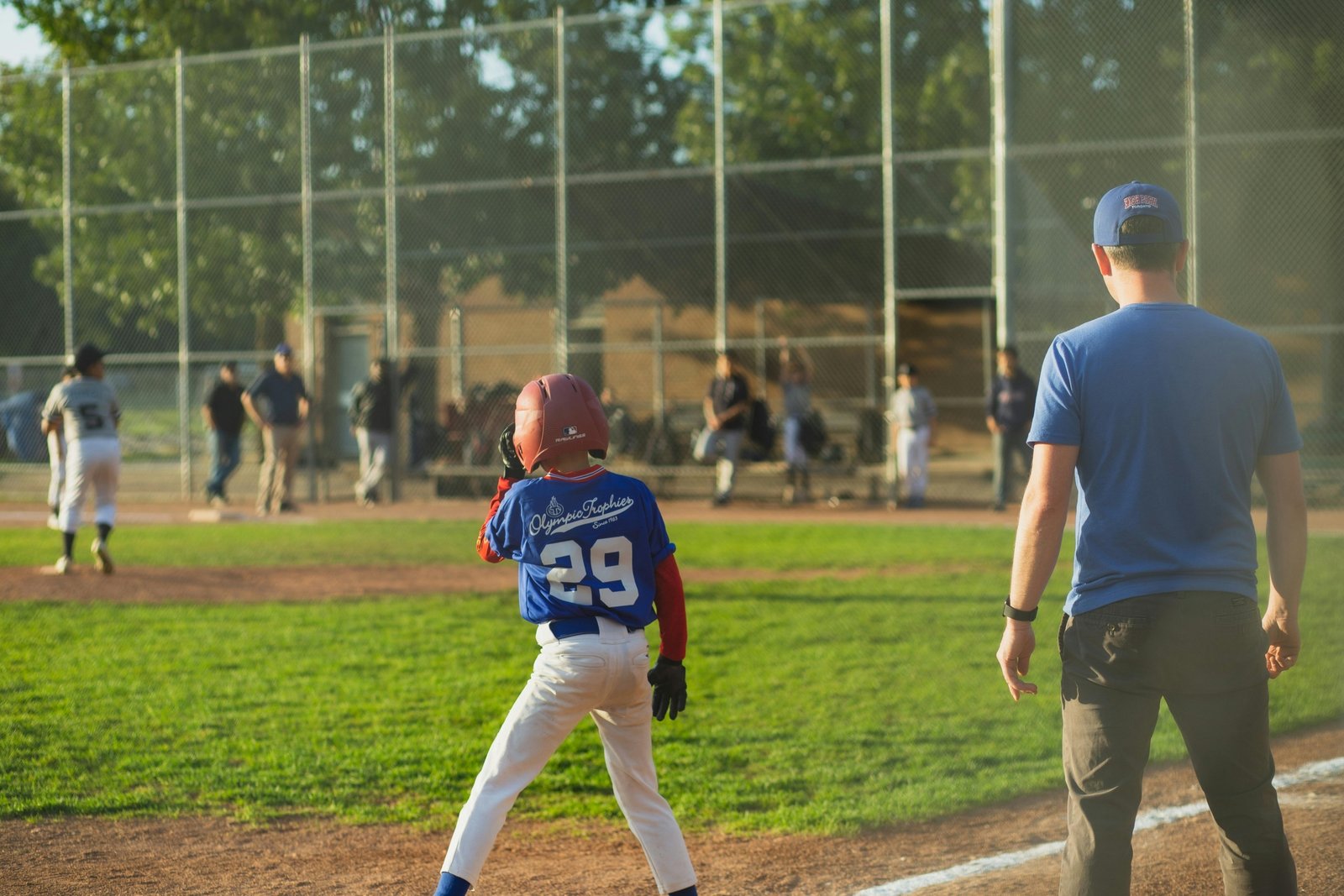 Competitive youth travel baseball team playing a game on a field, illustrating the pursuit of top rankings and player development.