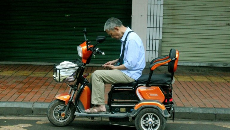 Go Go Elite Traveler portable mobility scooter providing independence and freedom for a senior person traveling or navigating daily life.