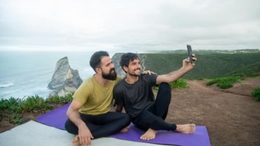 Two sisters, 'Wellness Wanderers', joyfully embodying healthy travel, fitness, and wellness, perhaps doing yoga or hiking in a beautiful destination, inspiring a balanced lifestyle on the go.