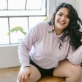 Confident plus size woman in stylish, comfortable travel clothes, showcasing a versatile wardrobe perfect for any vacation adventure.