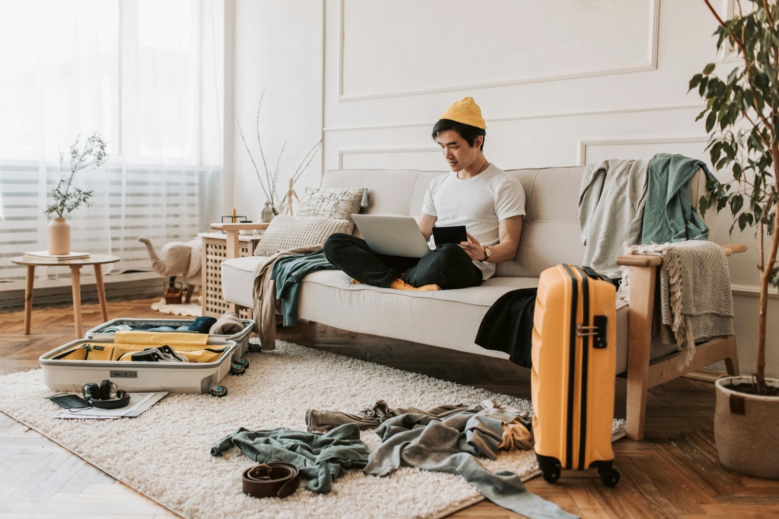 Stylish man packing a travel size men's cologne into his carry-on, emphasizing TSA-friendly fragrance for modern jet-setters and confident travel.