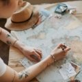Traveler confidently planning international trips for 2025, holding a passport and smartphone, symbolizing preparedness for evolving global entry requirements and a smooth journey.