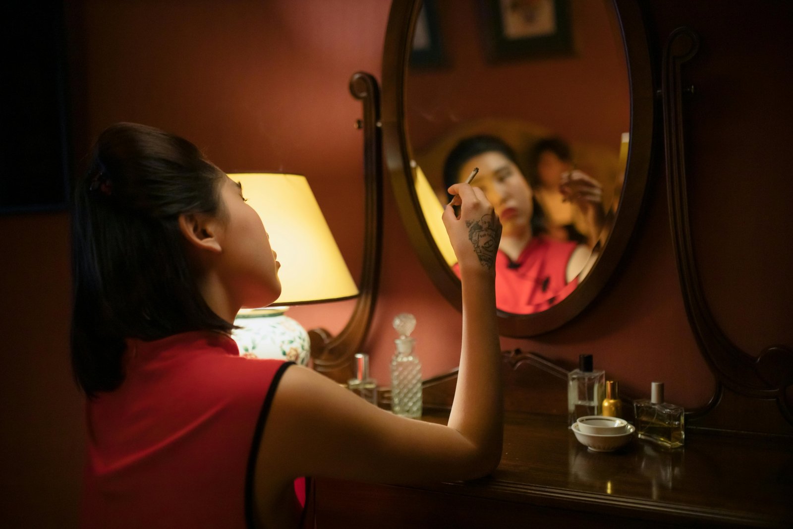 Portable LED travel makeup mirror for flawless application in a hotel room on vacation.