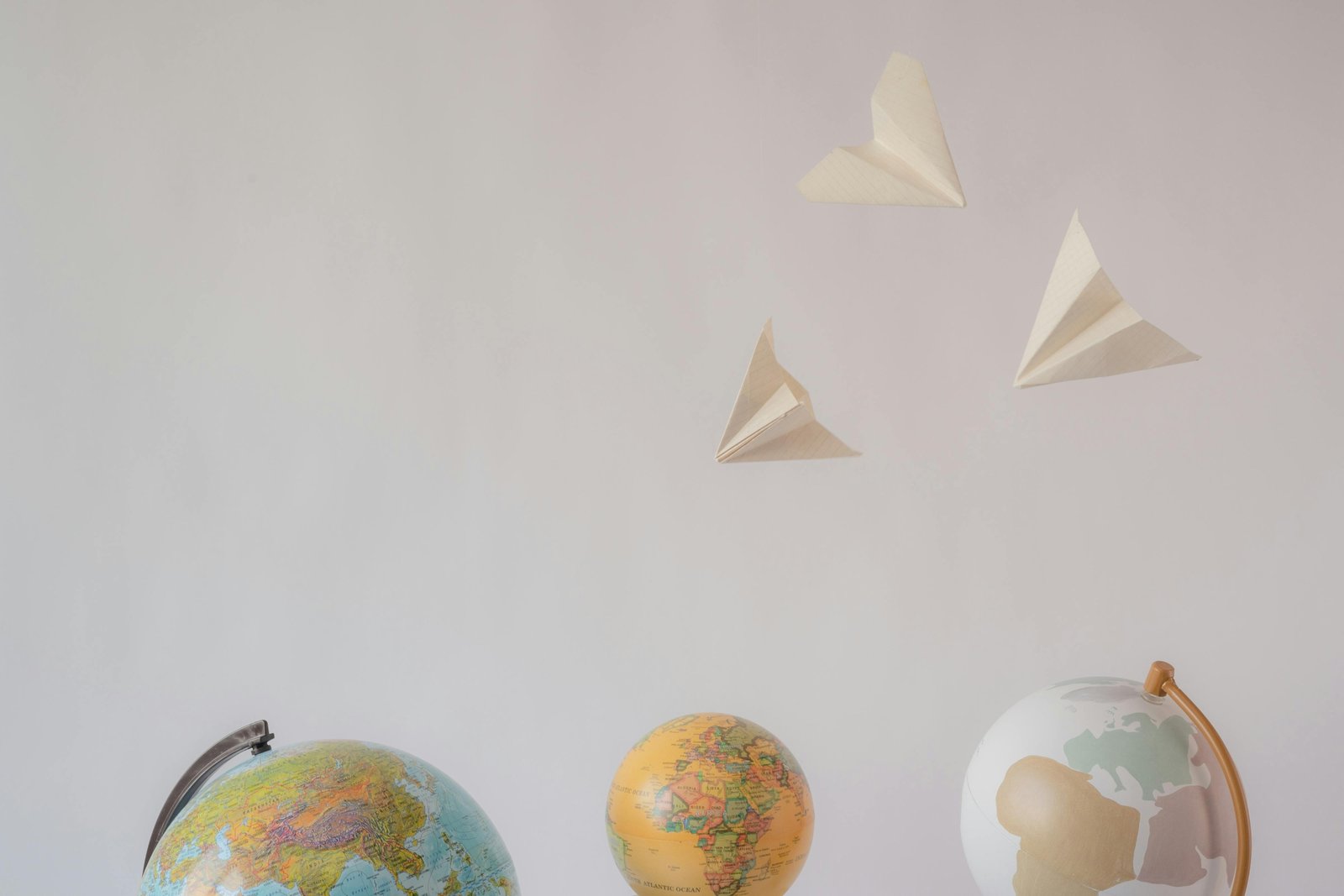 Minimalist travel tattoo ideas for wanderlust and adventure, featuring symbols like a compass, world map, and paper airplane design to inspire unique body art.