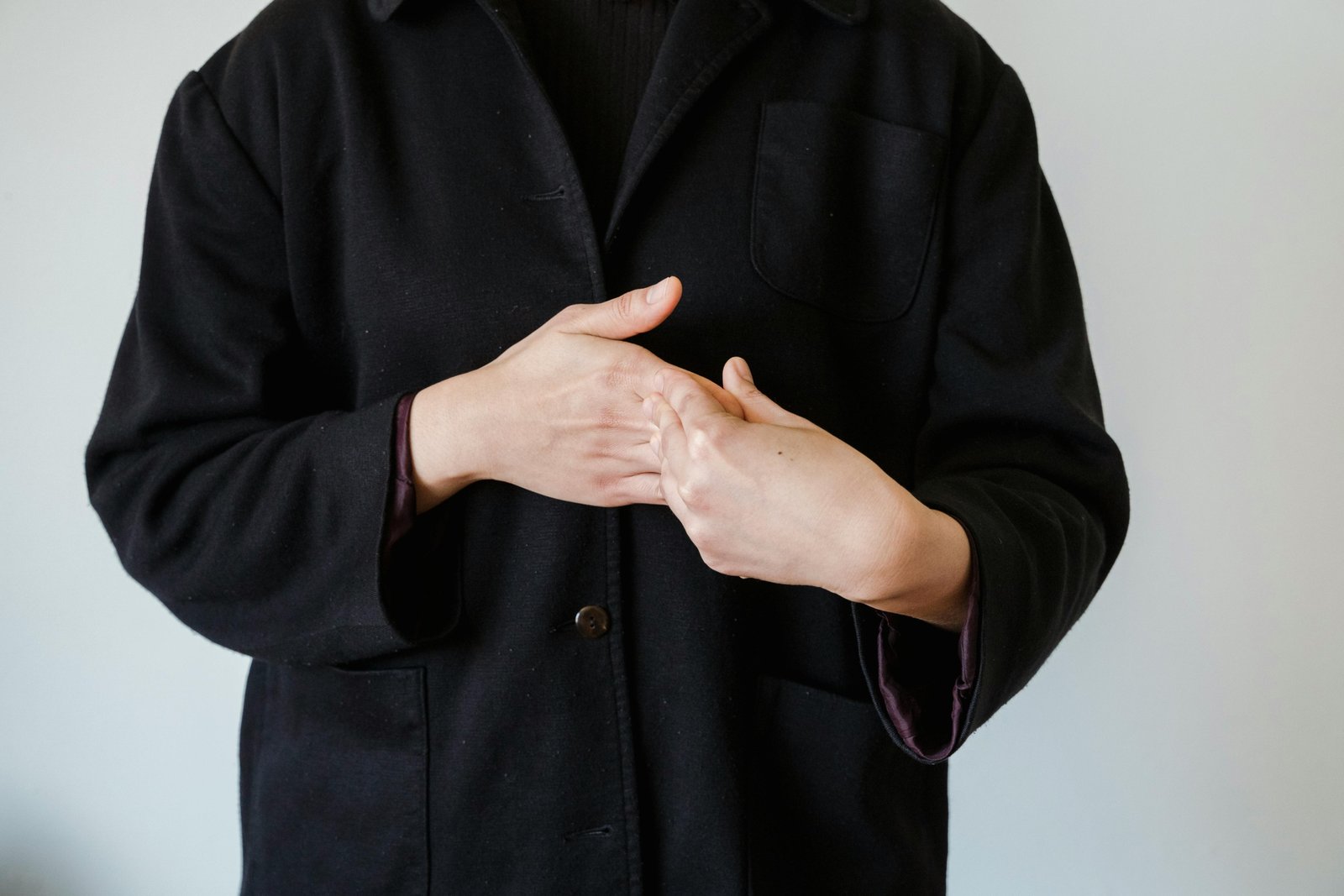 Hands demonstrating the ASL sign for 'travel' in American Sign Language, symbolizing visual communication for journeys and global exploration within the deaf community.