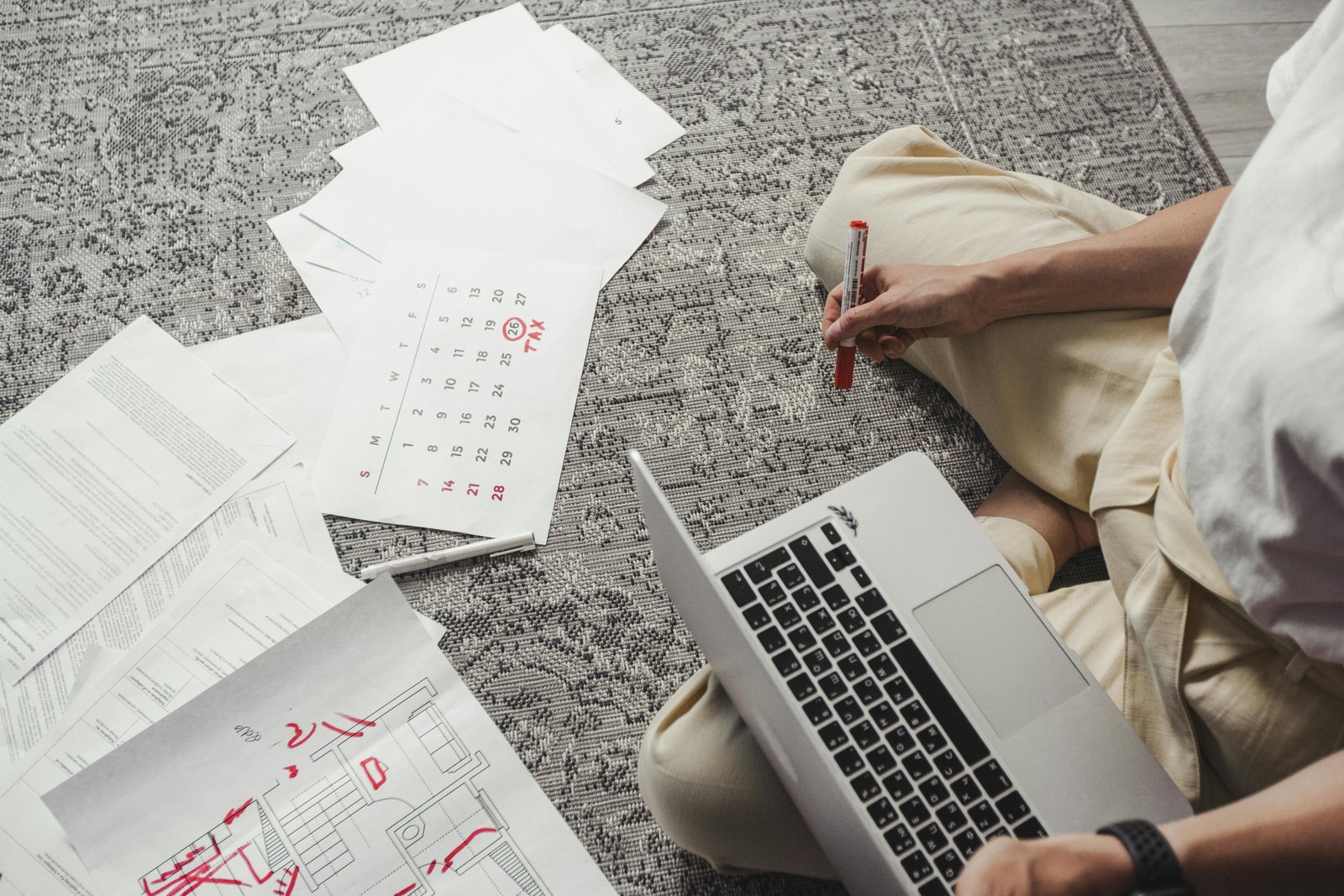 Best day to book air travel to save money on flights, with a person planning their trip on a laptop and calendar.