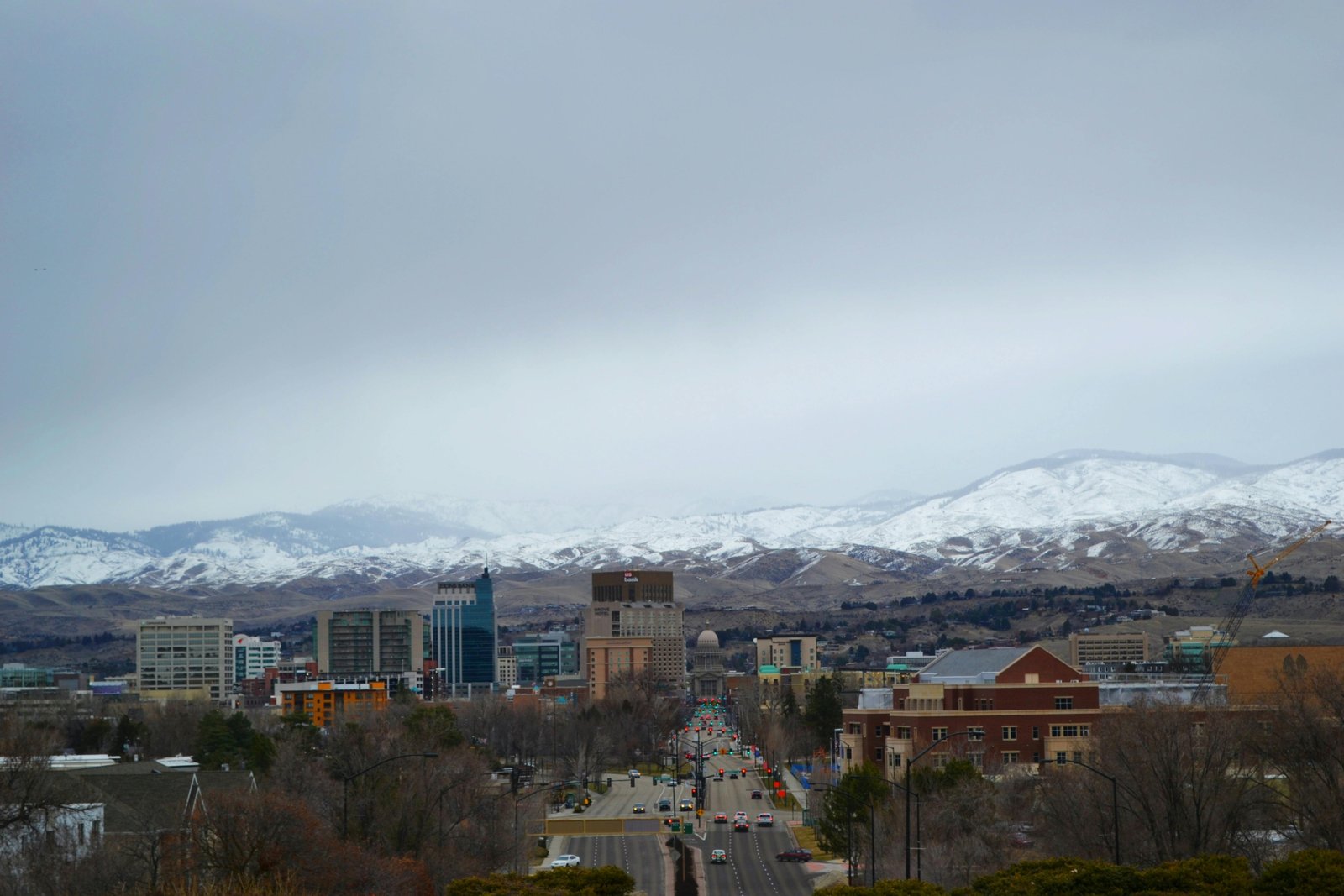 Diverse travel destinations across the USA for February, featuring a vibrant collage of warm sunny beaches, snowy mountain peaks, and bustling city skylines, highlighting unique experiences.