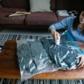 Compressed clothes inside an open suitcase using travel vacuum bags, illustrating efficient packing and luggage organization for smart, space-saving travel.