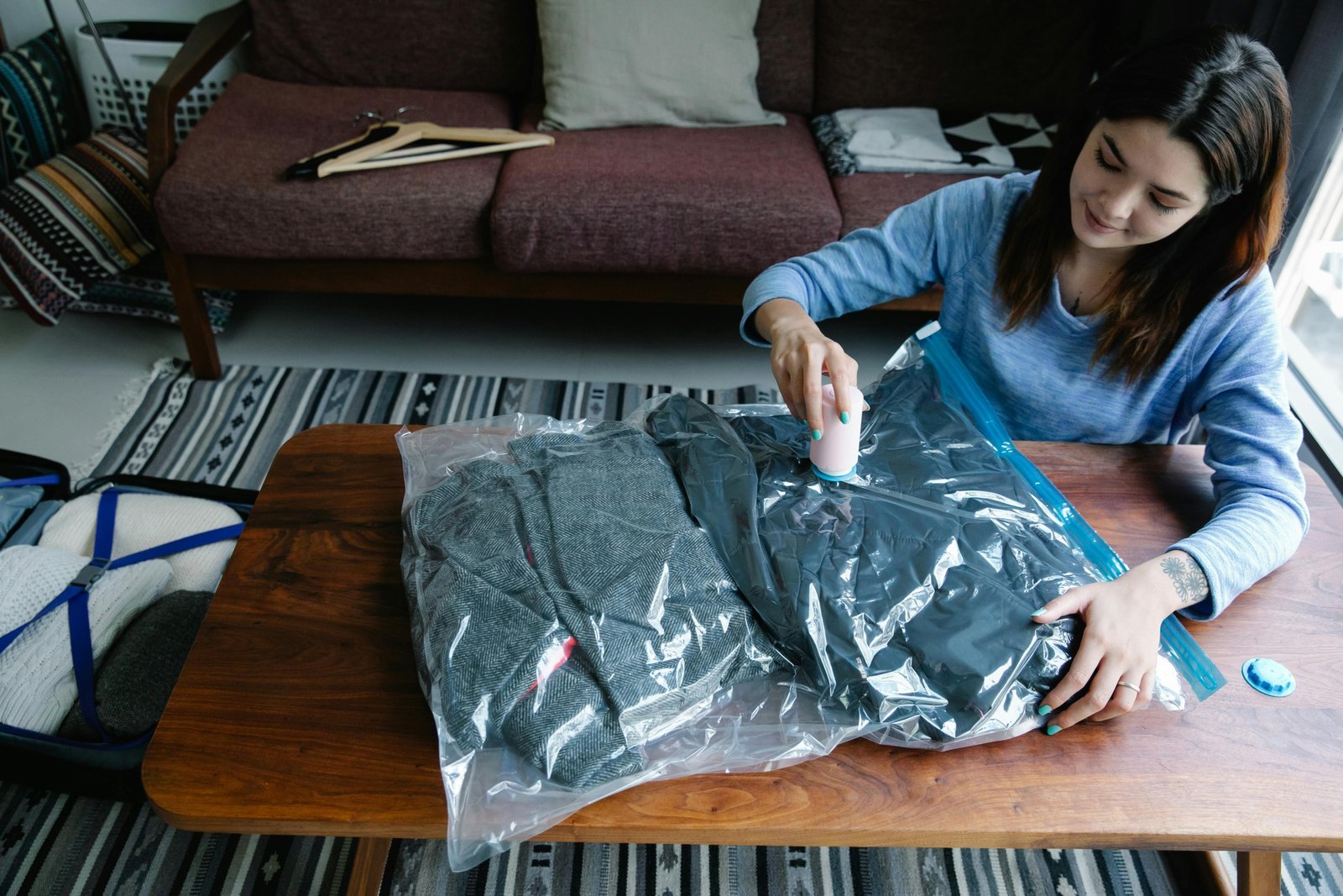 Compressed clothes inside an open suitcase using travel vacuum bags, illustrating efficient packing and luggage organization for smart, space-saving travel.
