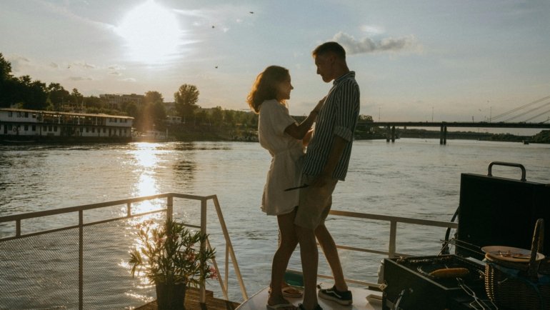 Happy traveler reviewing a custom Tess Travel Solutions itinerary, showcasing personalized, stress-free luxury vacation planning with expert guidance.