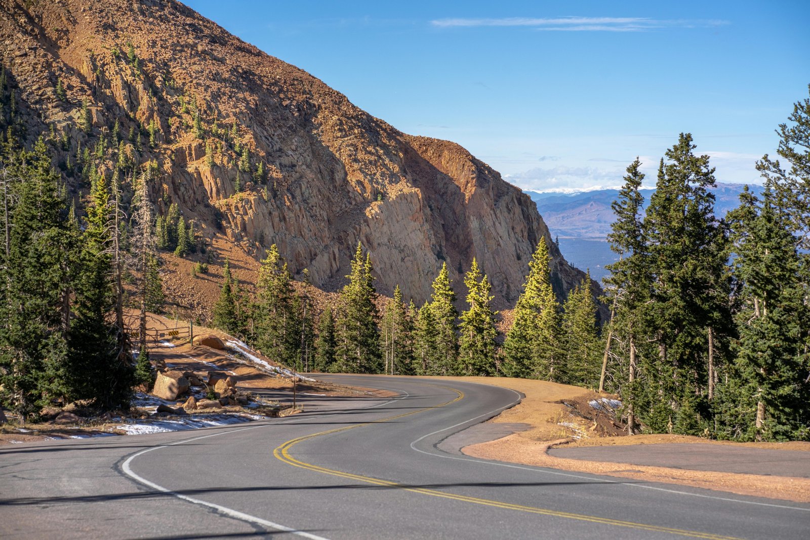 Scenic view of the majestic Rocky Mountains in Colorado, symbolizing diverse natural beauty and year-round adventures for travelers.