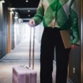 Professional travel agent booking and enjoying IHG luxury hotel personal trip with discounted rates.