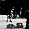 Basketball player demonstrating proper footwork and pivot technique, illustrating how to avoid traveling violations according to official rules.