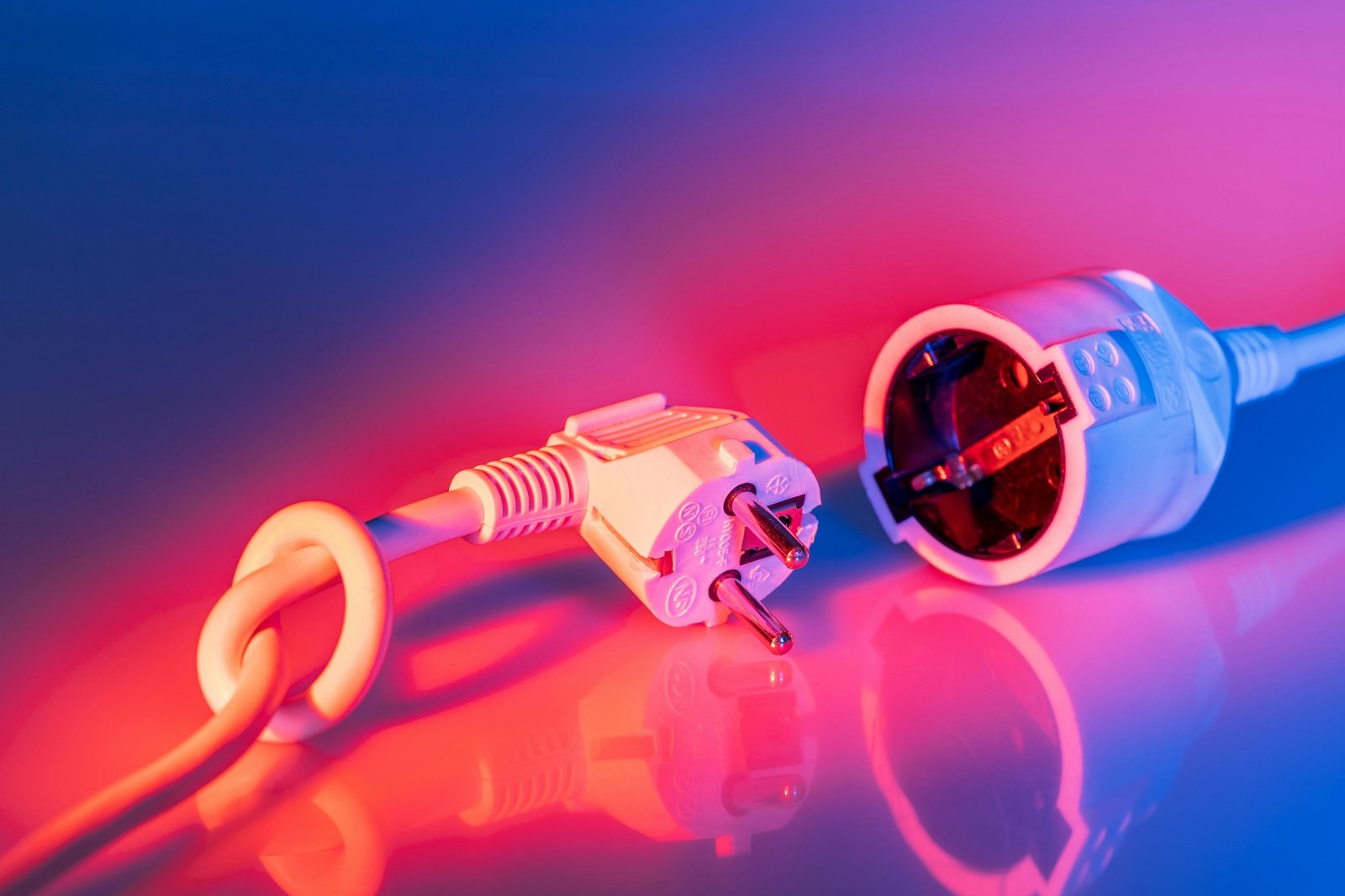 A robust 30 amp power cord safely connected to a travel trailer at a campsite, highlighting reliable electrical power for RVs and outdoor adventures.