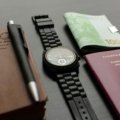 Organized flat lay of Europe travel essentials including passport, map, universal adapter, and comfortable clothing for a stress-free trip.