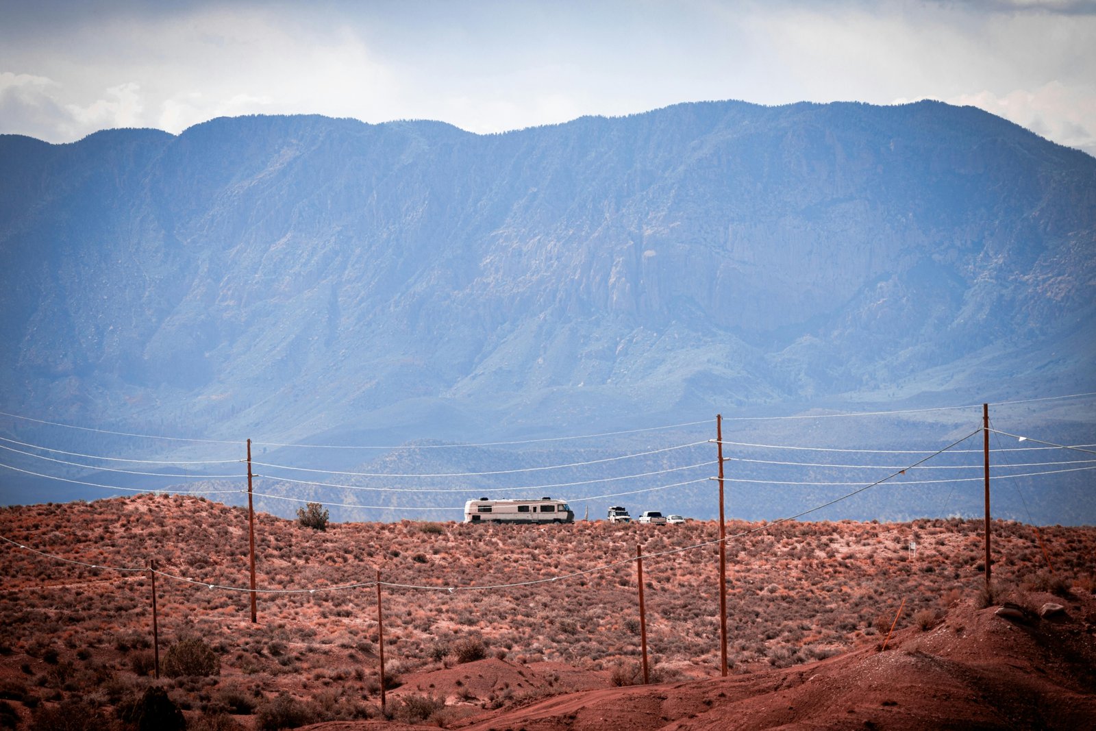 Ember travel trailer in a rugged wilderness setting, showcasing off-road capability and comfortable off-grid adventure.